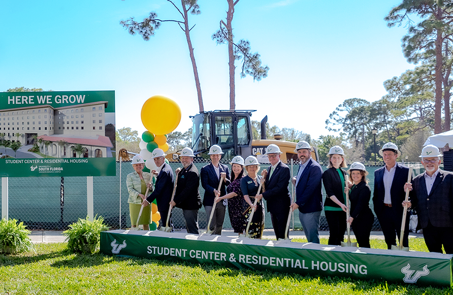 Community leaders hold shovels for the groundbreaking ceremony of the new Sarasota-Manatee student center and residence hall.