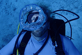Man underwater with scuba gear