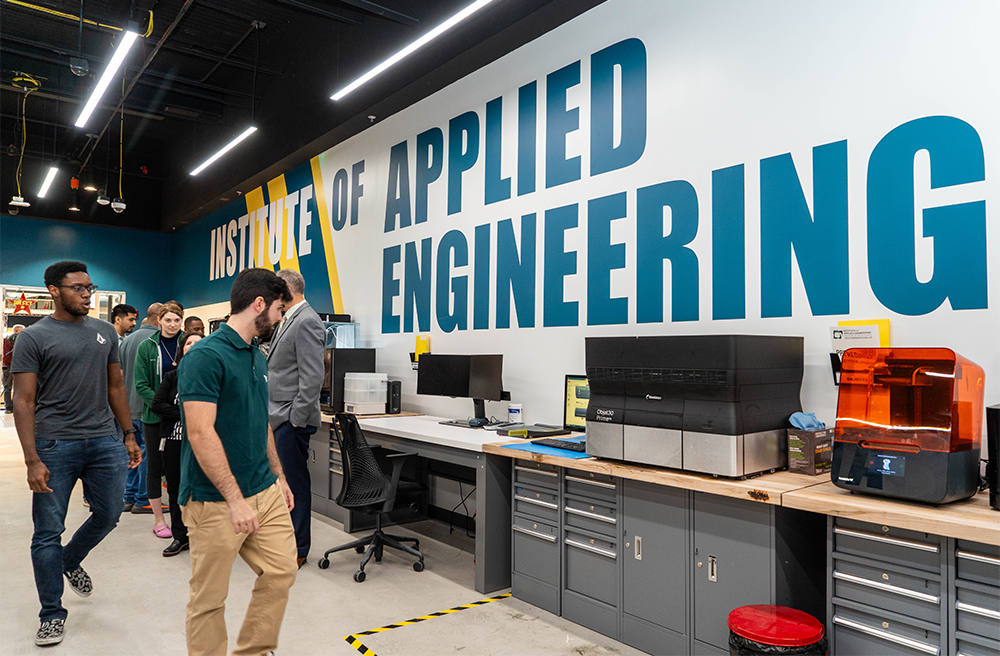 Group walks through Institute of Applied Engineering lab